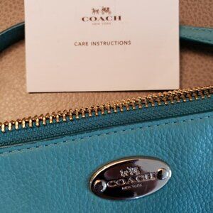 Coach double compartment crossbody bag, teal leather.